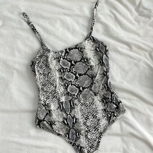 Grey/white/black snake print bodysuit from PLT